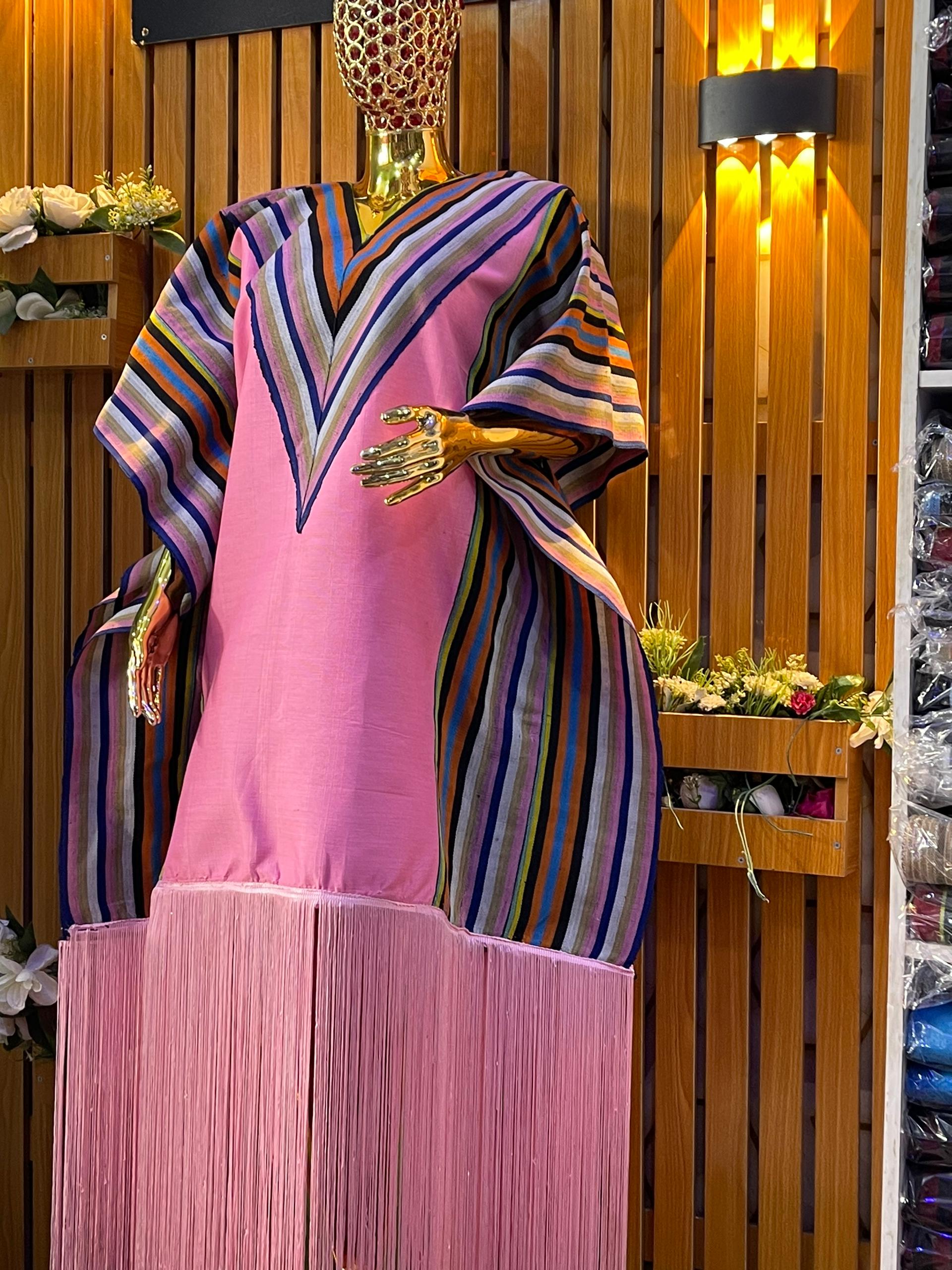Pink kaftan with wide rainbow V-stripe sleeves and pink fringe